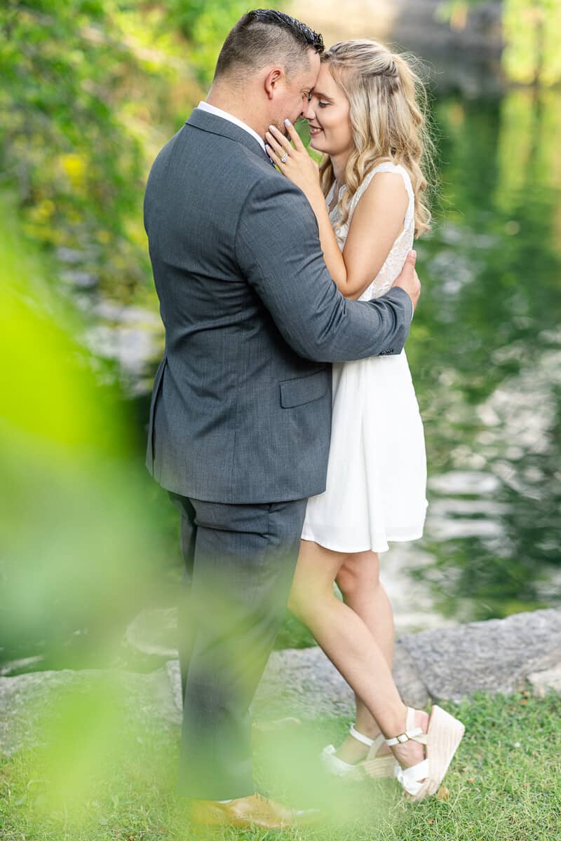 Elopement bride and groom touch foreheads in sunset glow
